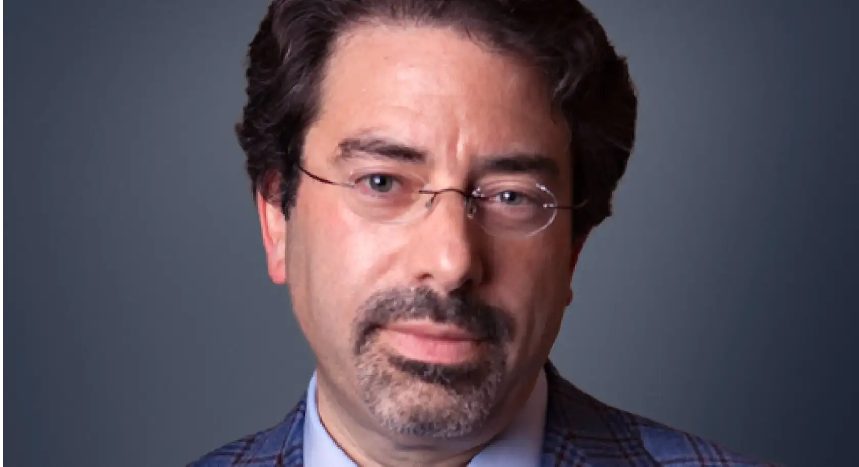 Portrait of Moshe A. Milevsky against a gradient blue background